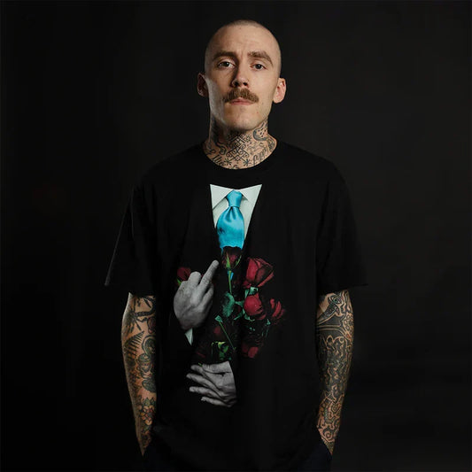 Man wearing the black Eminem TDOSS Middle Finger Roses T-shirt with red rose graphic