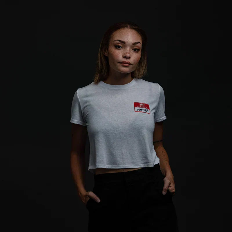 Model in the white Eminem Hi! My Name Is cropped T-shirt, red Slim Shady name tag