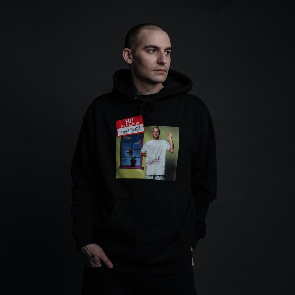 Man wearing the black Eminem My Name Is hoodie with photo panel chest print