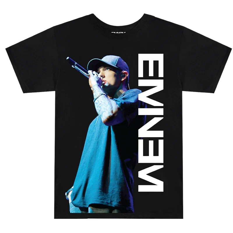 Black Eminem On The Mic T-shirt flat lay, blue-lit stage photo beside a vertical white Eminem logo