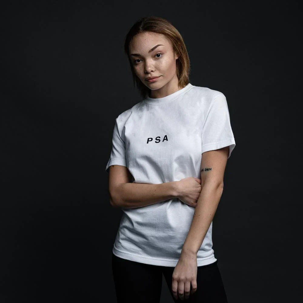 Woman wearing the white Eminem PSA T-shirt with small PSA chest print