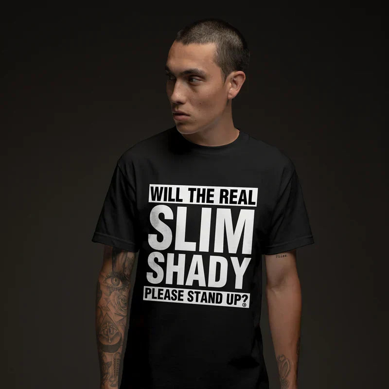 Man wearing the black Eminem Please Stand Up T-shirt reading Will The Real Slim Shady