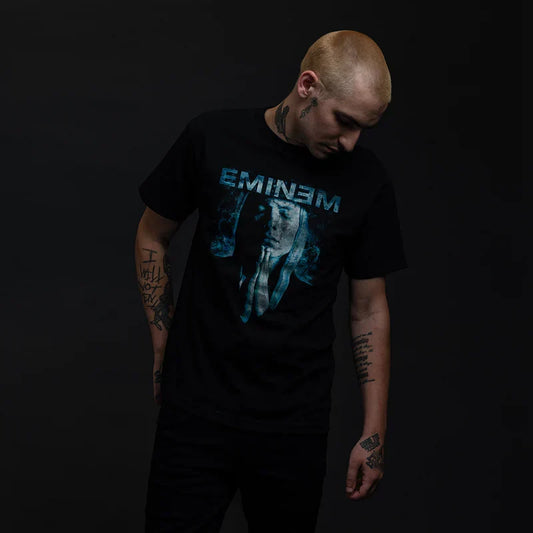 Man wearing the black Eminem Praying graphic T-shirt with blue-lit portrait print