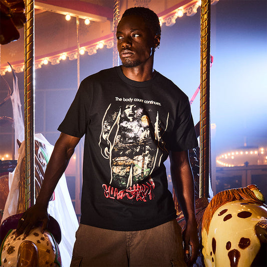 Man wearing the black Eminem Body Count T-shirt with Slim Shady chainsaw graphic and red logo