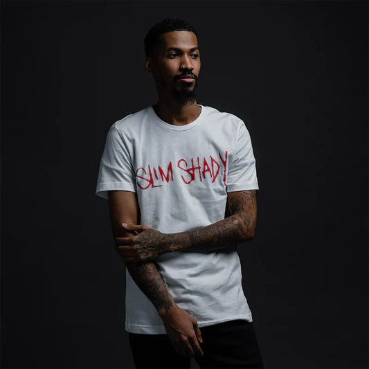 Man wearing the white Eminem Slim Shady Signature T-shirt with red graffiti chest print