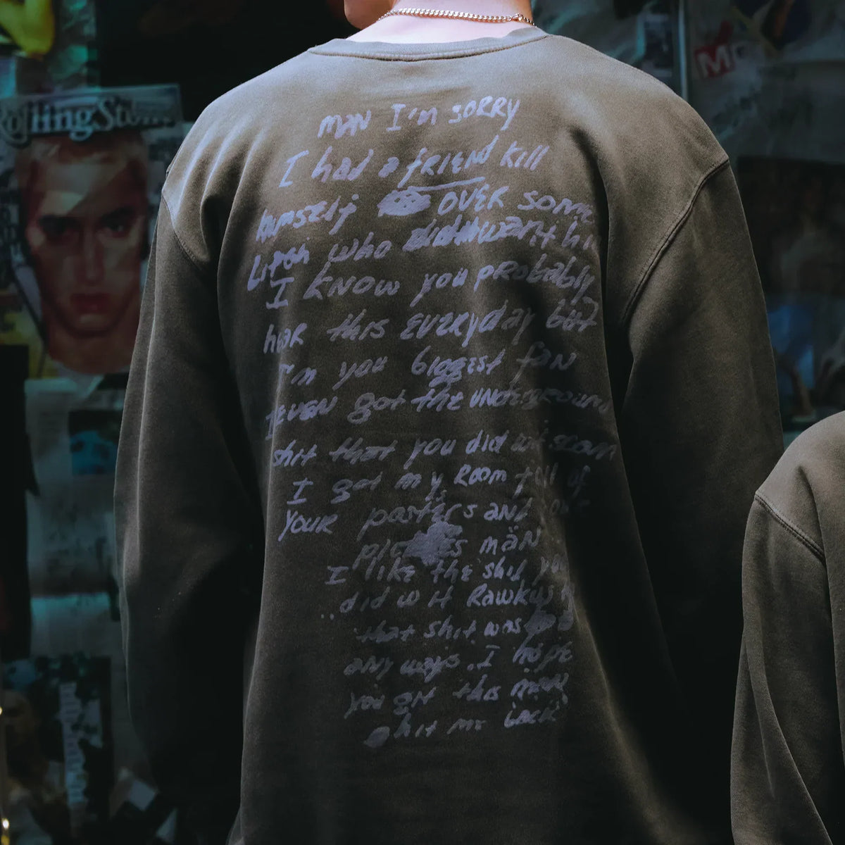 Close-up of the handwritten Dear Slim lyric print on the back of the Eminem crewneck