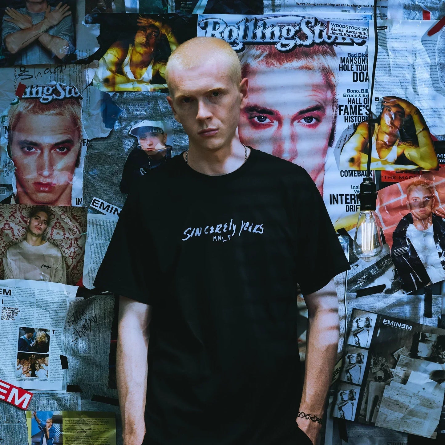 Man wearing the black Eminem Dear Slim T-shirt with small Sincerely Yours chest print