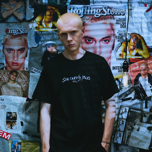 Man wearing the black Eminem Dear Slim T-shirt with small Sincerely Yours chest print