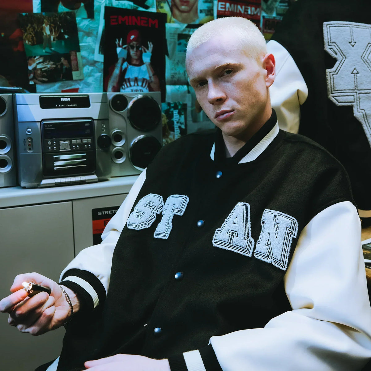 Man wearing the Eminem Stan varsity jacket with chenille STAN chest letters