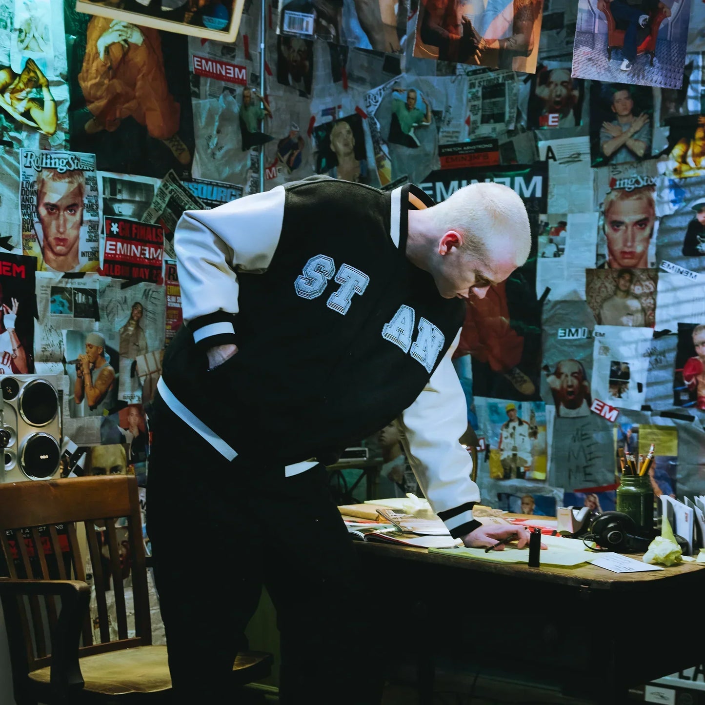 Back of the Eminem Stan varsity jacket with chenille patch worn by a model