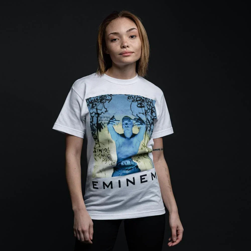 Woman wearing the white Eminem Still Don't T-shirt with blue-toned photo print