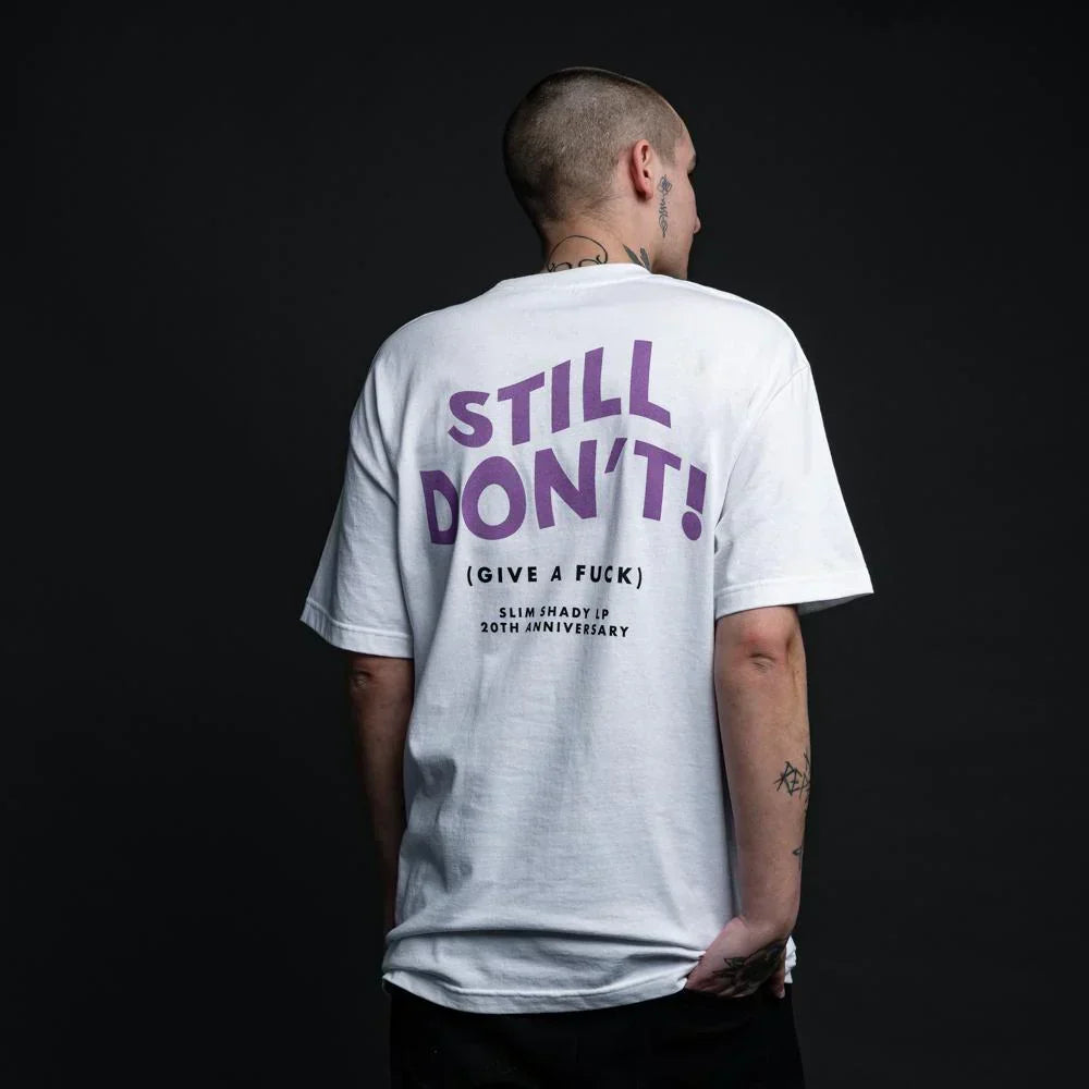 Back of the white Eminem Still Don't T-shirt with purple stacked lettering