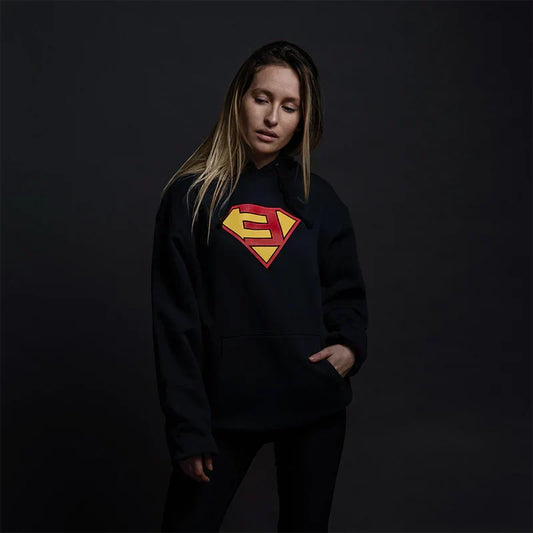 Woman wearing the black Eminem Super-E logo hoodie, comic-style shield graphic