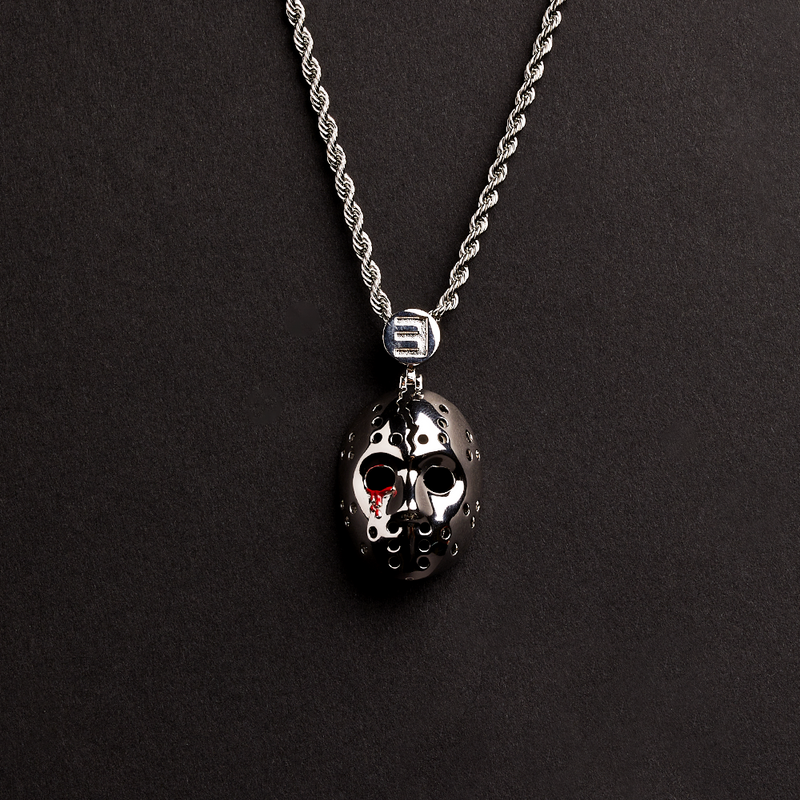 Close-up of the silver Eminem hockey mask pendant with red detailing and E logo bail