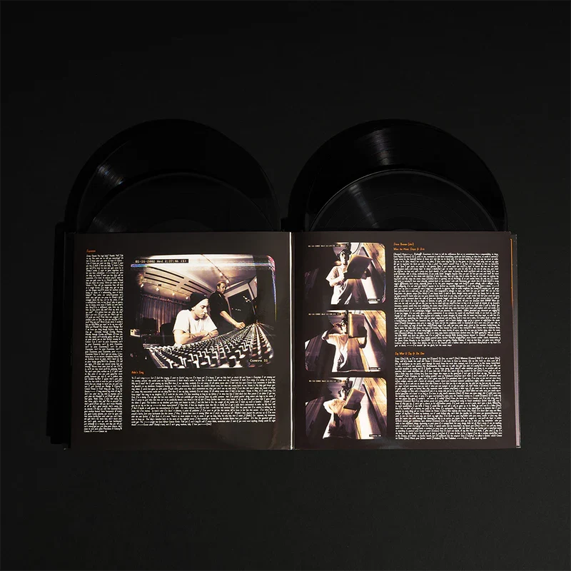 The Eminem Show 20th Anniversary 4LP gatefold open with black vinyl records and booklet