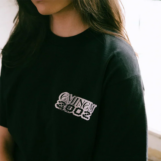 Close-up of the chrome Eminem 2002 chest print on the black Eminem Show T-shirt
