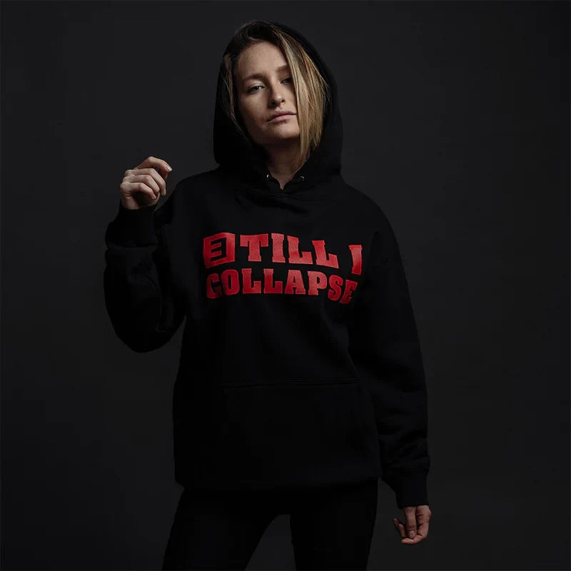 Woman wearing the black Eminem Till I Collapse hoodie, red logo chest print