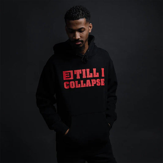 Man wearing the black Eminem Till I Collapse hoodie with red chest lettering