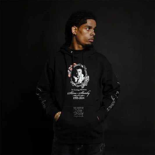 Man wearing the black Eminem TDOSS In Loving Memory hoodie with memorial print