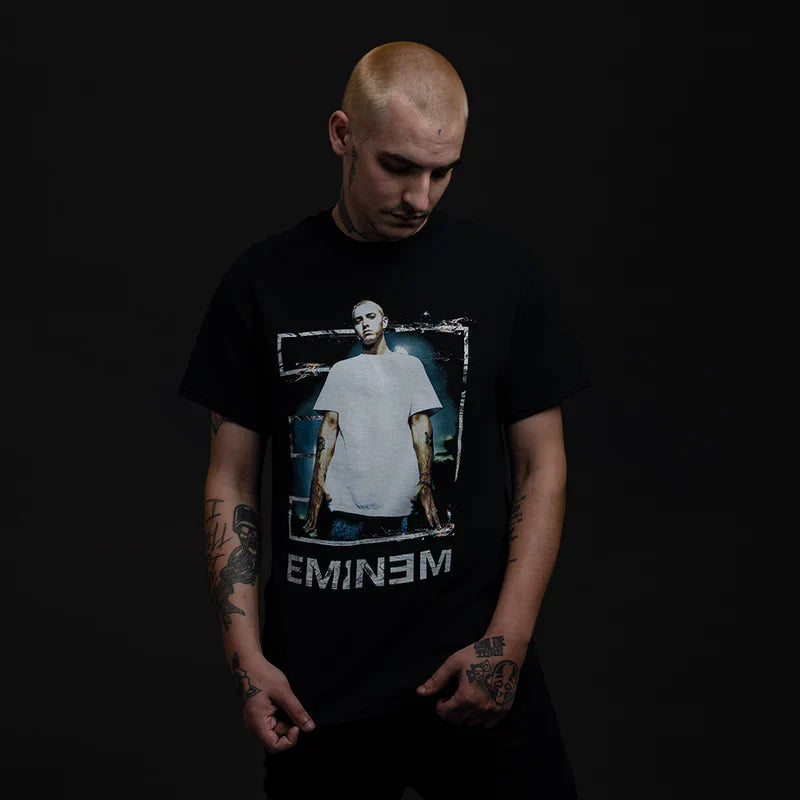 Man wearing the black Eminem Tower iconic E T-shirt with white-framed photo print