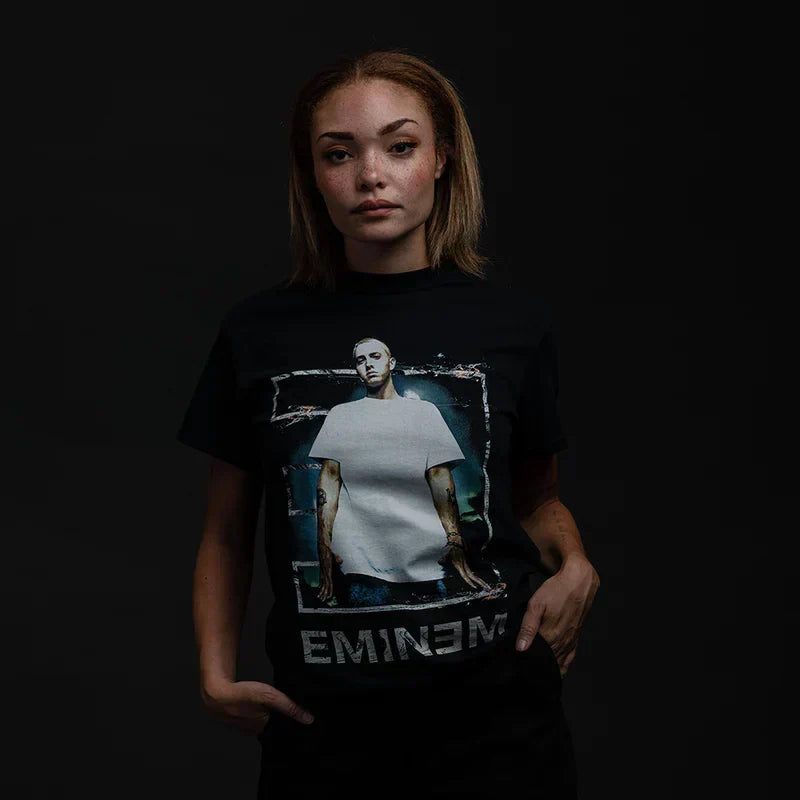 Woman wearing the black Eminem Tower T-shirt with photo panel and white Eminem logo