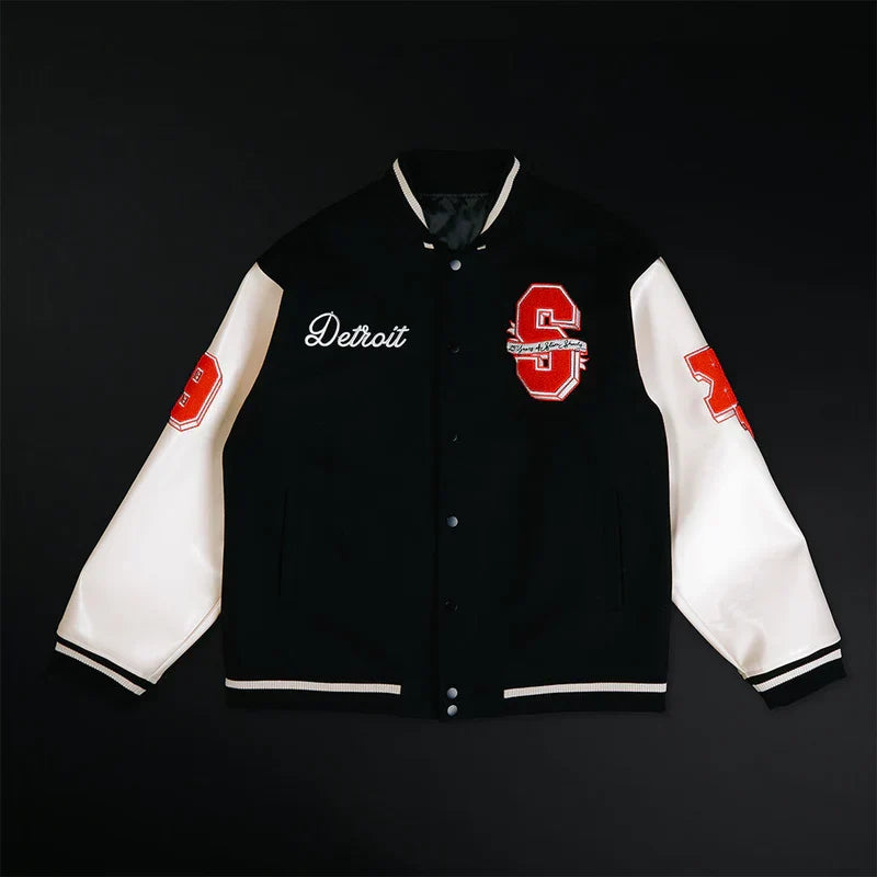 Eminem SSLP25 varsity jacket flat lay in black with cream leather-look sleeves