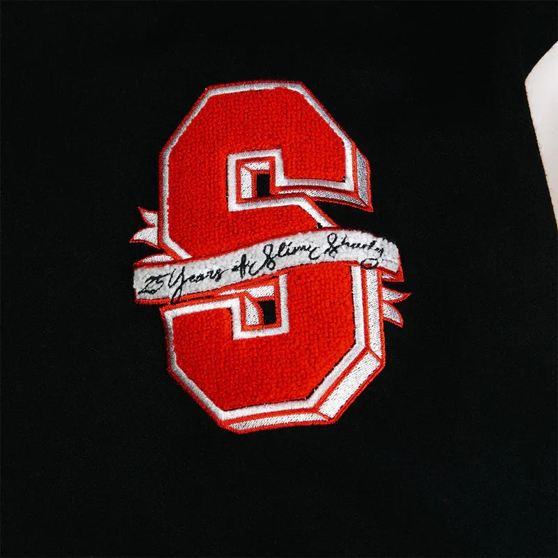 Close-up of the red S chenille patch reading 25 Years of Slim Shady on the Eminem jacket