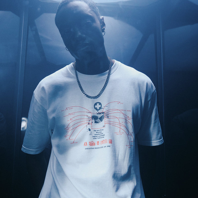 Man wearing the white Eminem Recovery Tracklist T-shirt with red line artwork