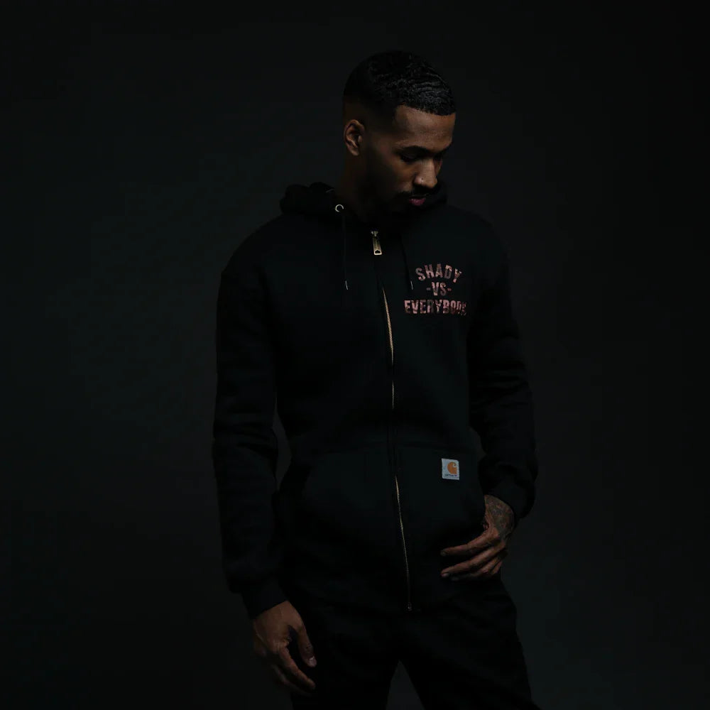 Man wearing the black Detroit Vs Everybody zip up hoodie, Eminem collaboration