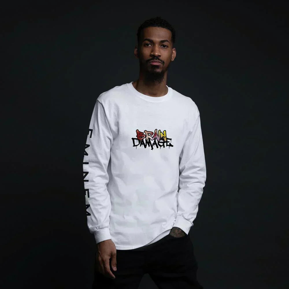 Man wearing the white Eminem Brain Damage long sleeve shirt with small chest logo