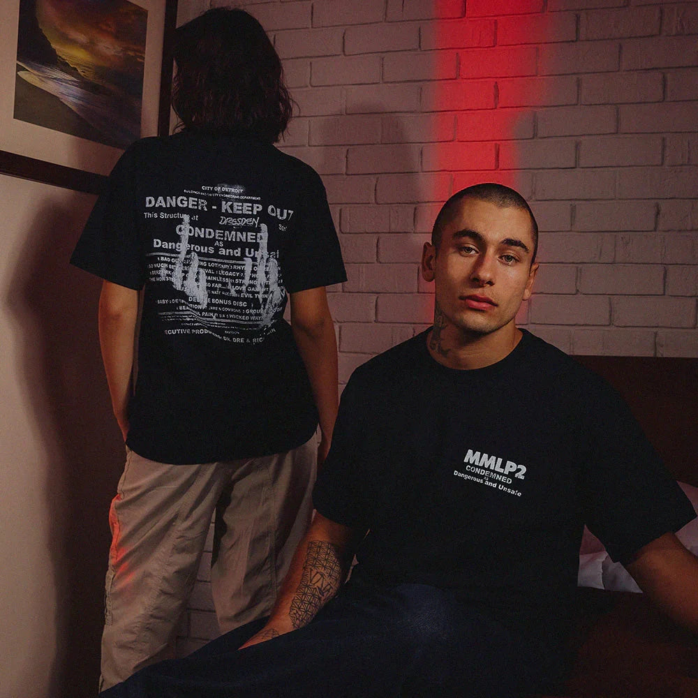 Models in black Eminem MMLP2 Condemned T-shirts showing the front and Danger Keep Out back print