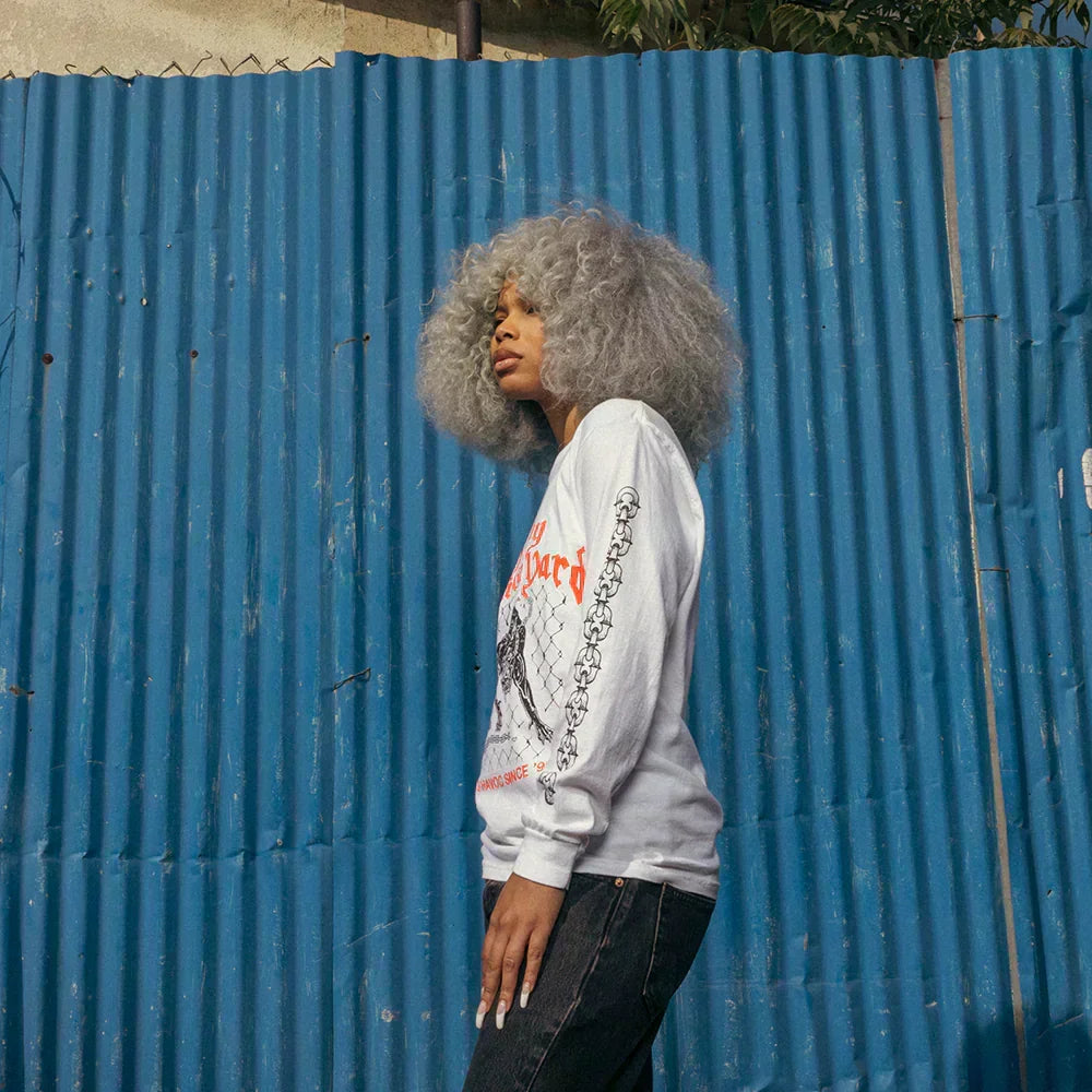 Side view of the white Eminem Shady Demolition Junkyard Dog long sleeve shirt