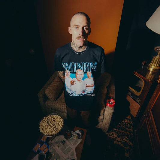 Man wearing the black Eminem SSLP25 Bootleg T-shirt with vintage rap tee photo print