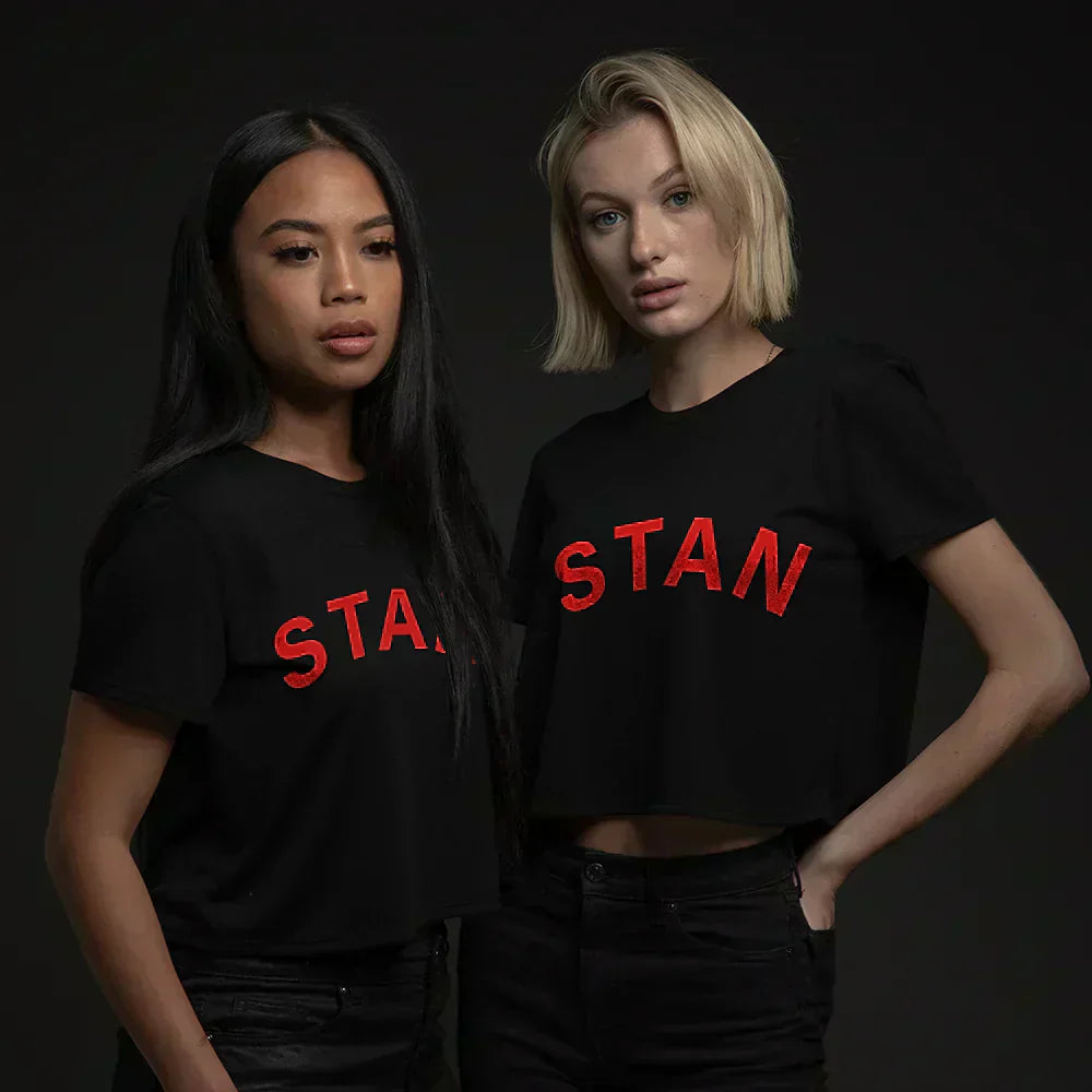 Two models wearing black Eminem Stan cropped T-shirts with red graffiti prints