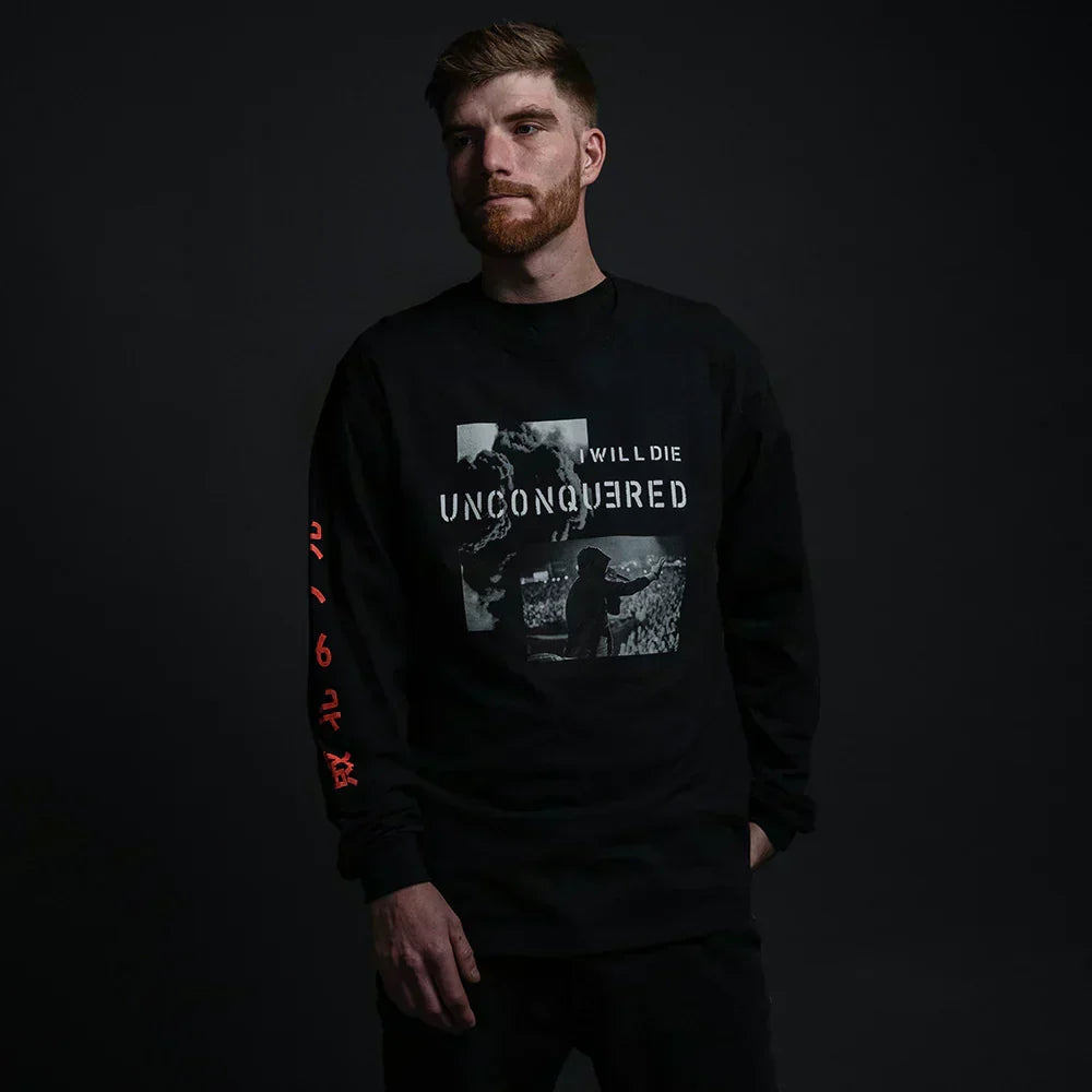 Man wearing the black Eminem Unconquered long sleeve shirt with photo print and red kanji sleeve