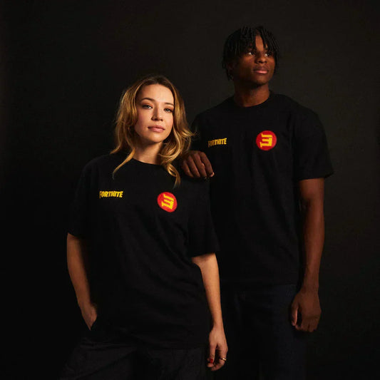 Two models in black Eminem x Fortnite T-shirts with yellow Fortnite and red E chest logos