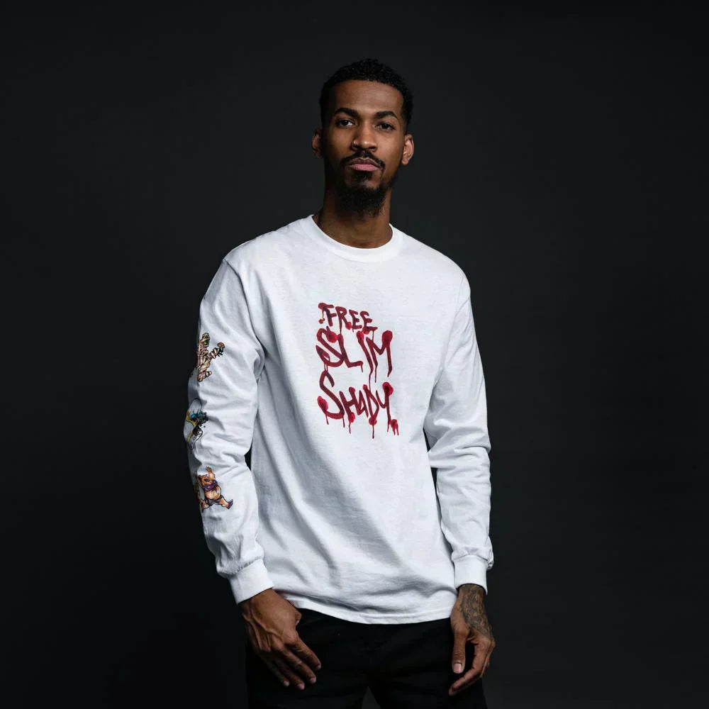 Man wearing the white Eminem Free Slim Shady long sleeve shirt with red script print