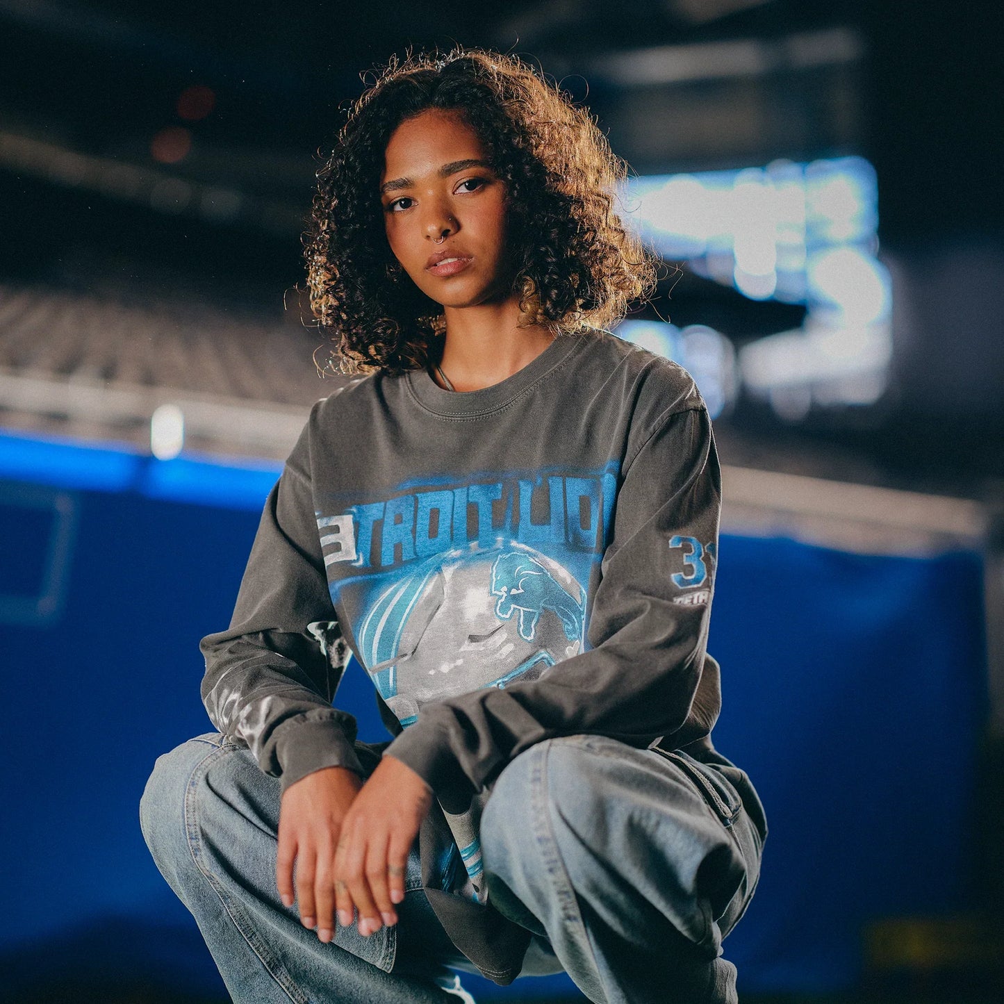 Eminem x Detroit Lions All Grit long sleeve worn in the stands, chrome football helmet print