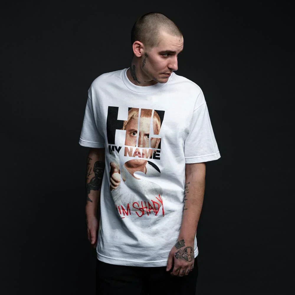 Man wearing the white Eminem My Name Is photo typography T-shirt with red Slim Shady text