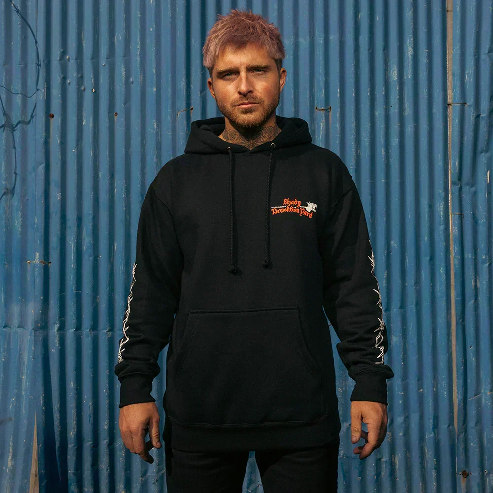 Man wearing the black Eminem Shady Demolition Barbed Wire hoodie, front view