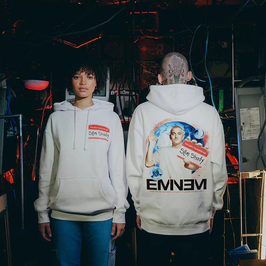 Two models in white Eminem SSLP25 Name Tag hoodies with red name tag and back art