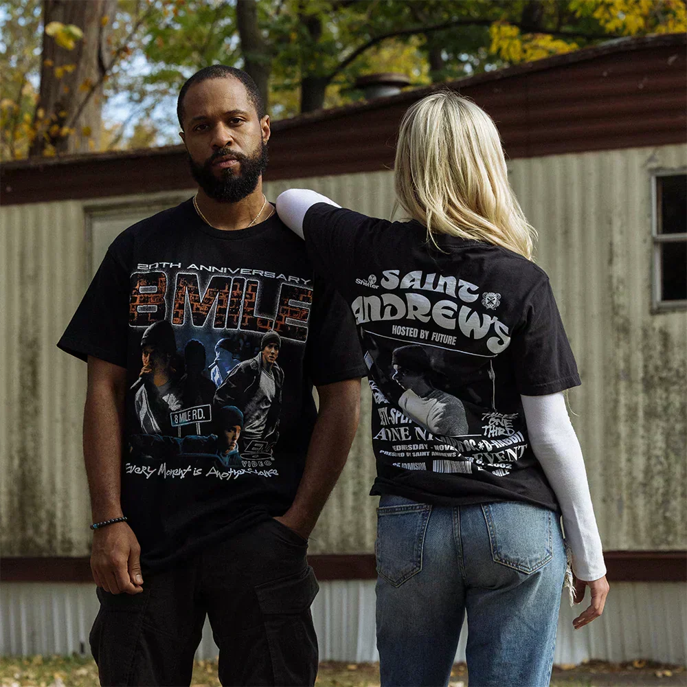 Two models in Eminem 8 Mile and St. Andrews event T-shirts outside a trailer home