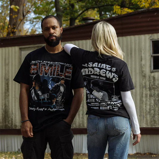 Two models in Eminem 8 Mile and St. Andrews event T-shirts outside a trailer home