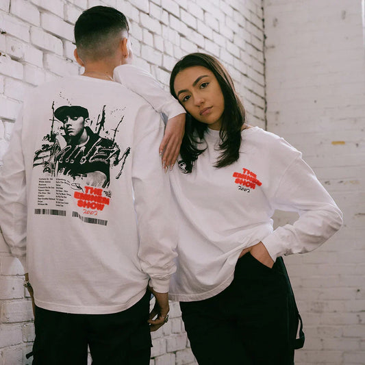 Two models in white Eminem Show long sleeve shirts with red text and photo prints