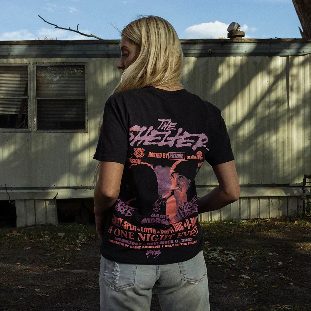 Back of the black Eminem Shelter event T-shirt with A One Night Event poster print